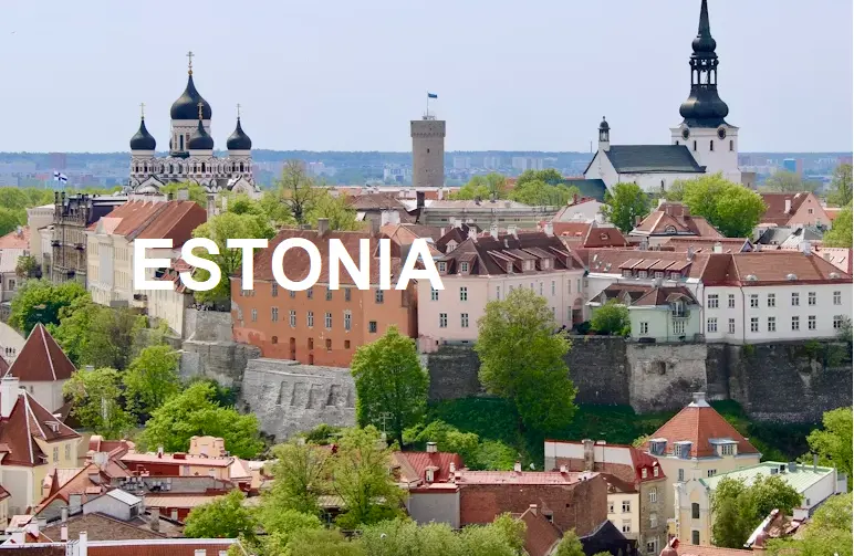 Stunning sunset view of Tallinn, Estonia, with medieval towers and bold ESTONIA text for a travel guide cover imag